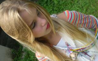 Gorgeous young blonde teen loves to pose