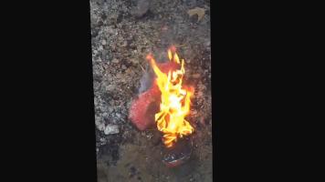 Boy burning shoes
