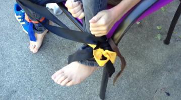 Tied to chair, feet too